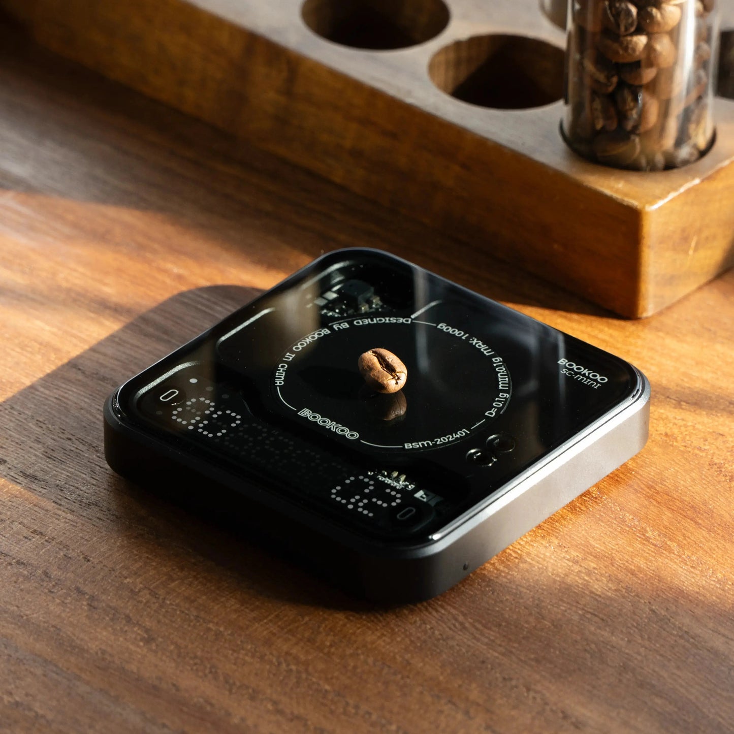 Bookoo Themis Mini coffee scale with coffee beans