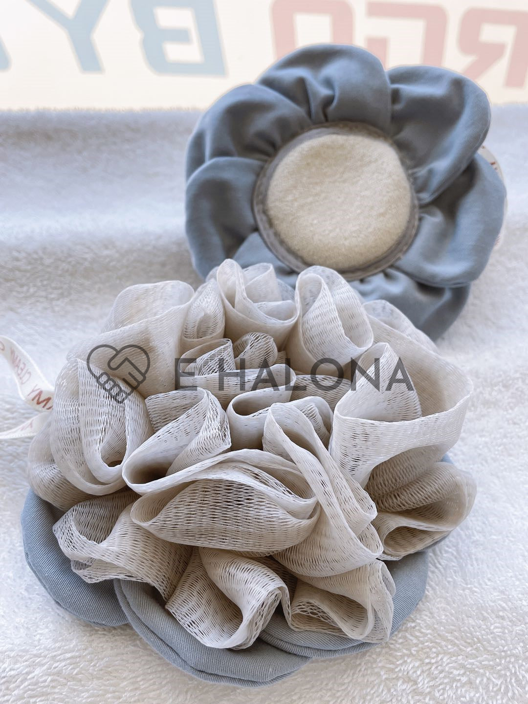 Hand-stitched cleansing puff hanging after use